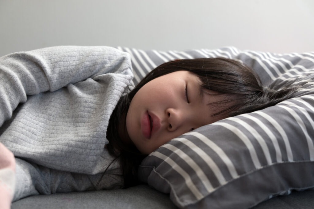 Teen sleeping comfortably after easing braces soreness