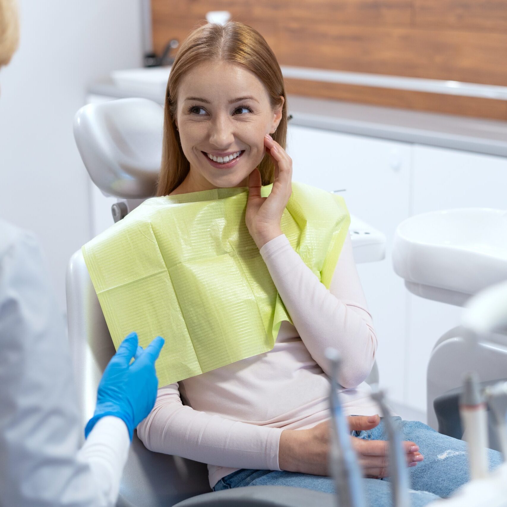 Smiling orthodontic patient feeling confident after comparing treatment options